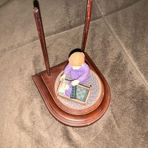 Handcrafted Wooden Figurine with Purple Accents